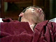 Alan Brandon lying dead on his mobile bed